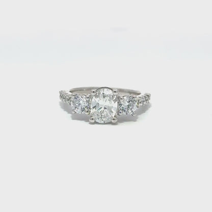 LADIES RING 2 1/2CT OVAL/ROUND DIAMOND 14K WHITE GOLD (CENTER STONE OVAL DIAMOND 1 1/2CT )